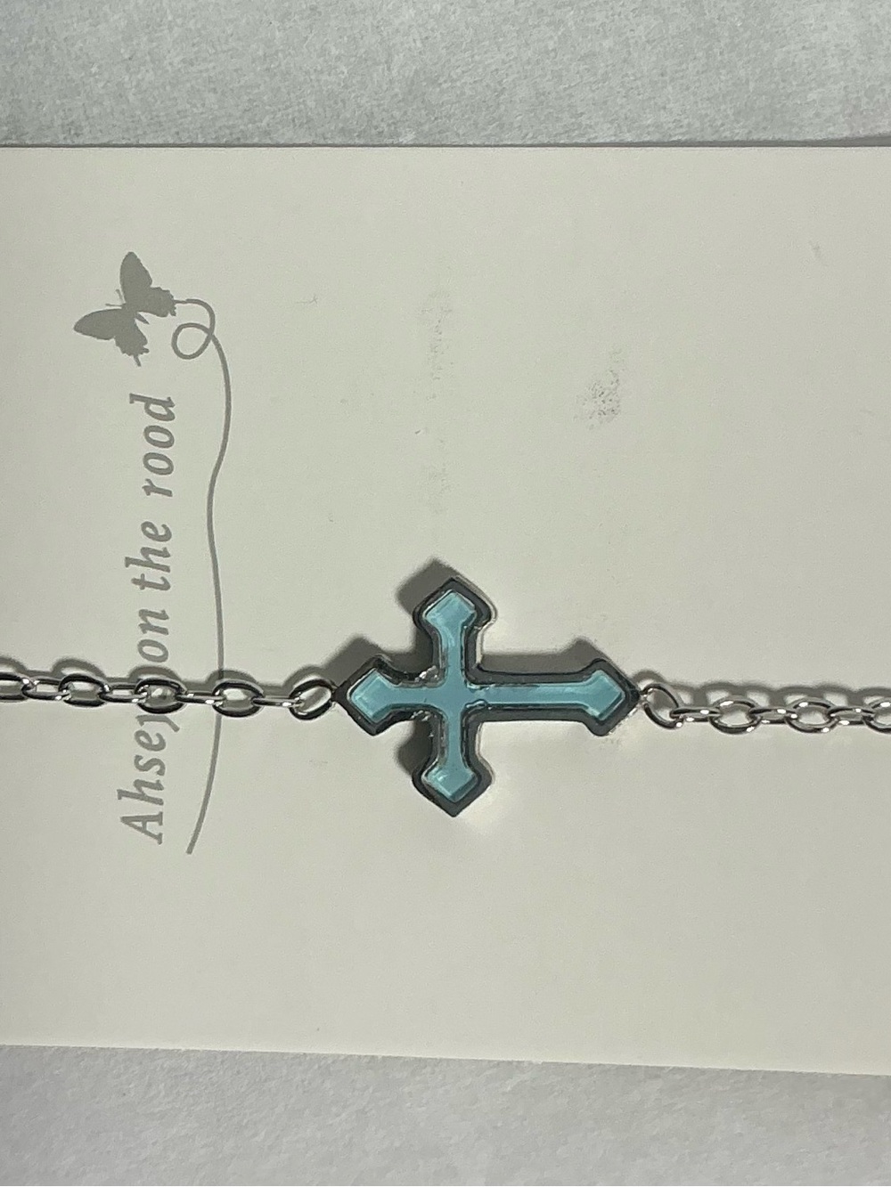 Gold-Tone Cross Pendant Bracelet with Blue Accent